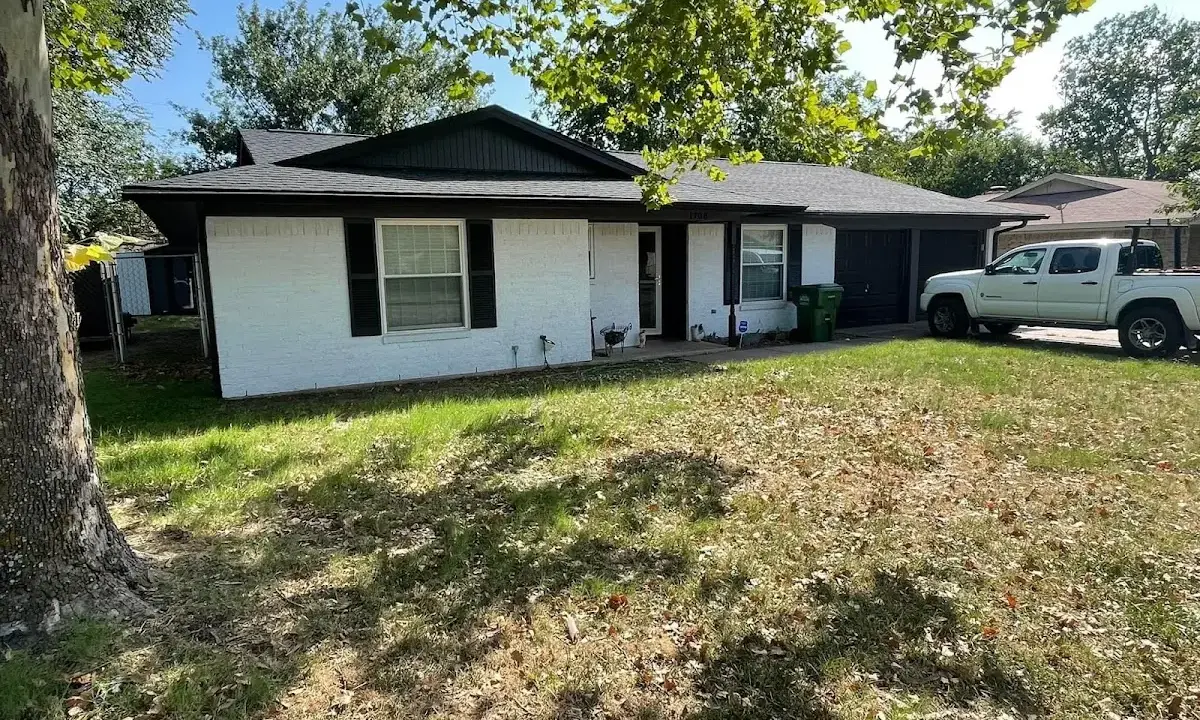 Professional roofing crew working on a residential roof in Glenn Heights